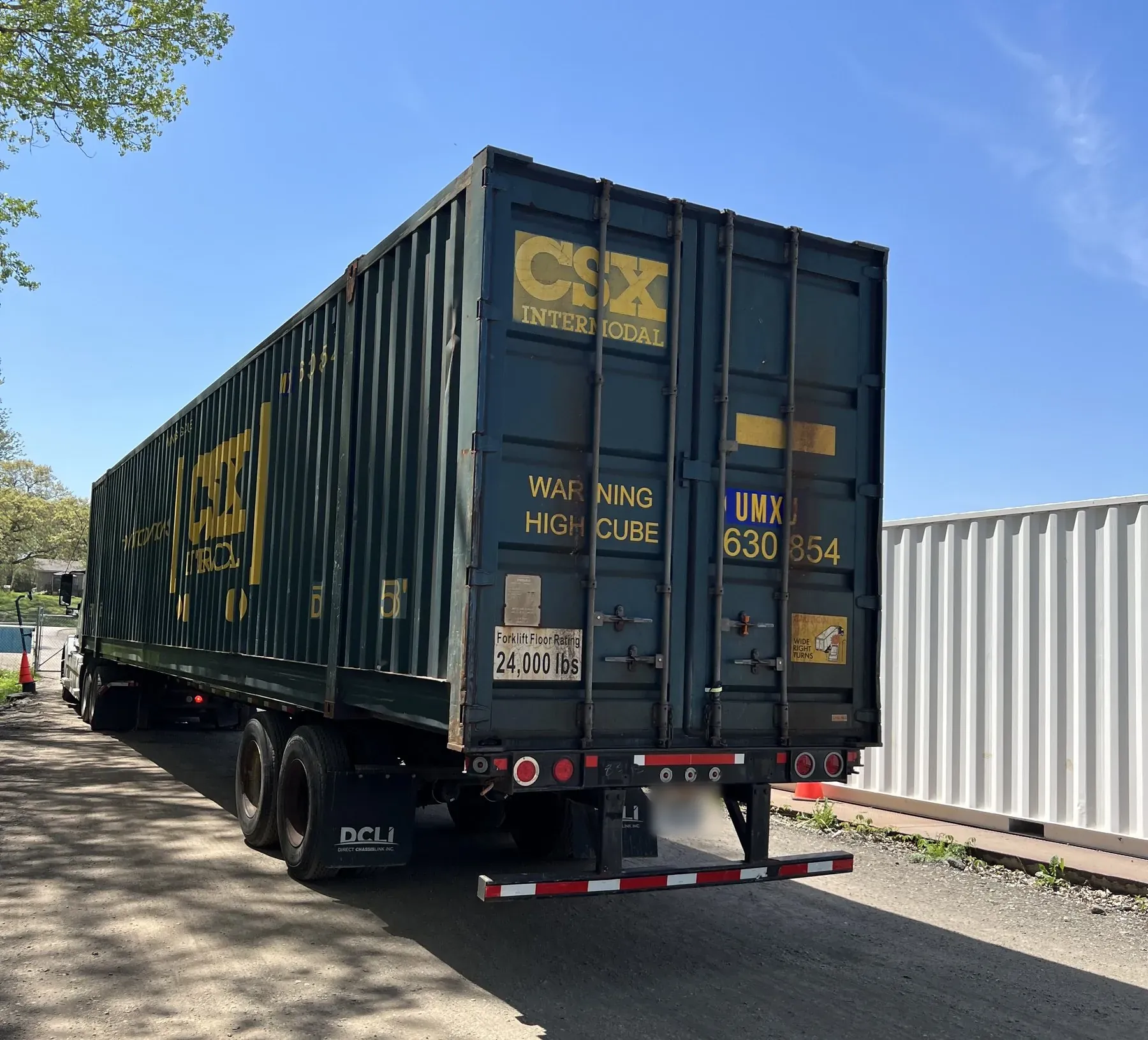 CSX Intermodal container on a chassis, backed in for delivery