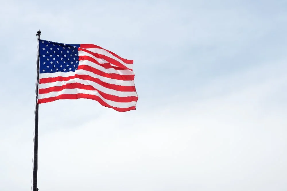 American flag flying against the sky